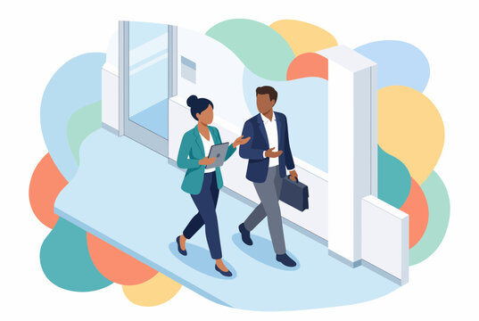 Colleagues walking and talking in a modern office hallway