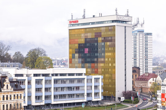 Colorful S Tower Office Building Overlooking Urban Skyline With Mountain Backdrop At Dusk. Liberec City Czech Republic