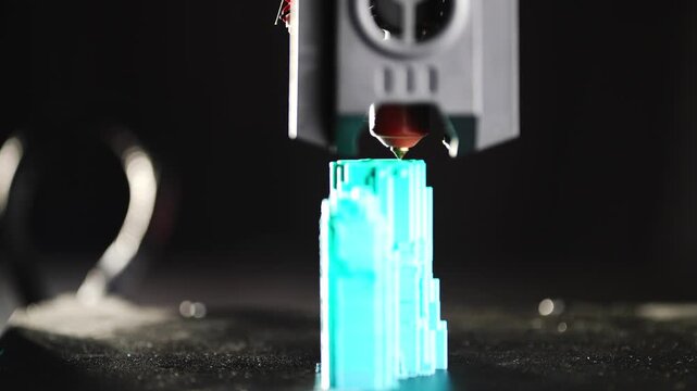 Modern 3D printer creating plastic part during automated printing process with advanced technology for industrial manufacturing and factory production. High quality 4k footage