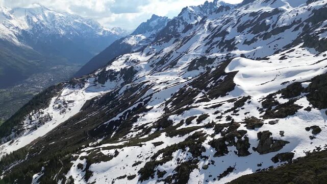 Cinematic drone flight above snowy alpine peaks near Lac Blanc in Chamonix, France, captured in slow motion