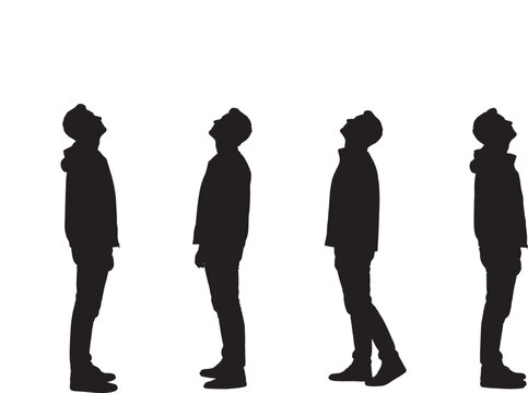 Silhouettes of a man standing and looking up 
