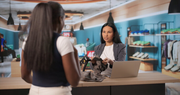 Store Manager Listens Carefully As Angry Customer Complains About Clothes