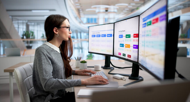 Young Marketing Manager Uses Computer