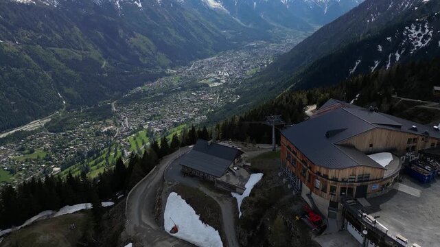 Cinematic drone view of Chamonix town from La Flegere in the French Alps, captured in slow motion