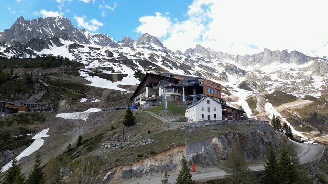 Cinematic drone view of the La Flegere mountain station and alpine refuge above Chamonix, France