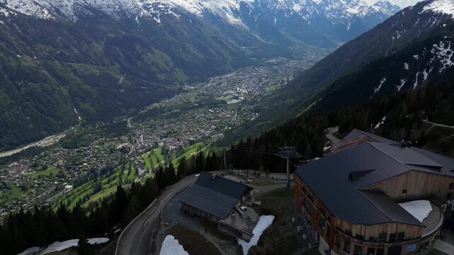 Cinematic drone view of Chamonix town from La Flegere in the French Alps, captured in slow motion