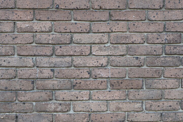 Naklejka premium Weathered Brick Wall Texture with Dark Natural Staining