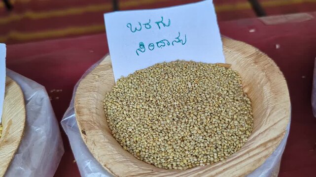 Closeup view of proso grain displayed at krishi mela showcasing fine grains