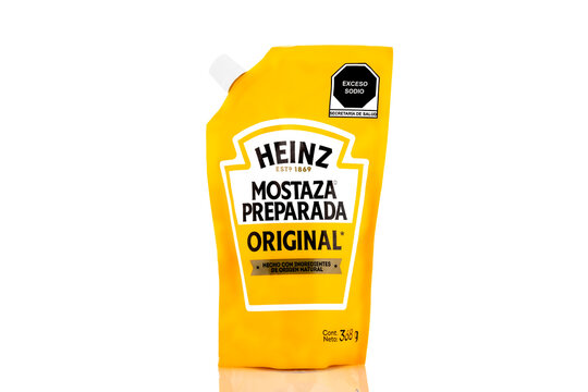 Heinz Mostaza Preparada Original mustard pouch packaging isolated on light background. Illustrative editorial studio product photography of condiment product for food and grocery concepts.