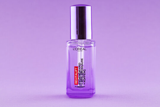 L&rsquo;Or&eacute;al Paris Revitalift eye serum with hyaluronic acid and caffeine on purple background. Illustrative editorial beauty product photography for skincare and cosmetic concepts.