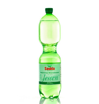 Saskia Jessen Still natural mineral water bottle isolated on light background. Illustrative editorial studio product photography for hydration and beverage concepts.