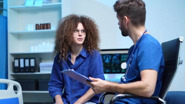 patient filling insurance legal document at appointment with doctor. woman patient signing medical treatment contract, agreement form for taking medic care service, consultation, therapy.