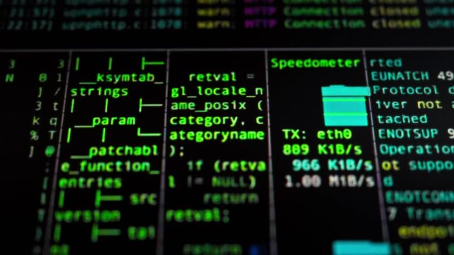 As programmer works on software development, the monitor screen displays rapid sequence of code lines, numbers, and symbols. This complex process utilizes artificial intelligence to drive automation