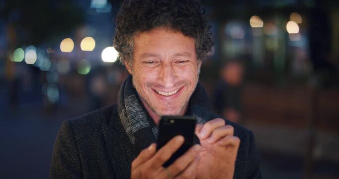 Night, man and laugh in city with phone, funny social media video or scroll website for online meme. Evening, bokeh or mature person in urban town with tech, mobile app or humor for text message joke