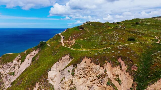 Aerial view of coastal cliffs and ocean at Praia da Ursa  in Cascais, Portugal