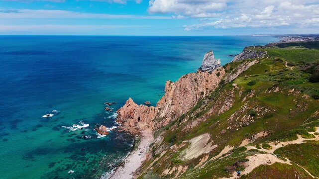 aerial view of praia da ursa cliffs on a sunny day with clear sky. Cascais, Portugal