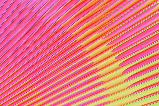 Abstract futuristic background featuring radial metallic red, pink, orange, yellow stripes with soft gradients.