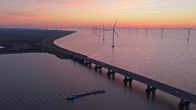 Stunning aerial view of an offshore wind farm and the ketelbrug bridge