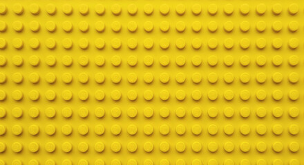 Fototapeta premium Yellow plastic building block plate texture background for kids toys