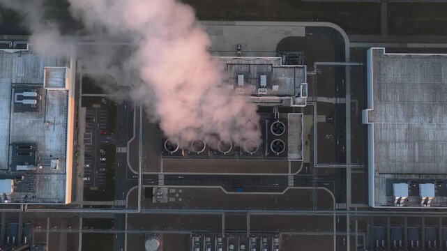 Aerial top down view of a data center emitting vapor