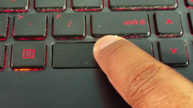 Hand interacting with "ctrl" button laptop keyboard, perfect for office, freelance, and online work content.