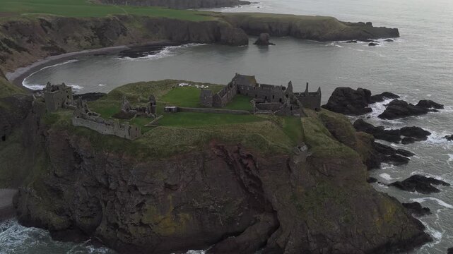 Dunnottar castle ruins on a cliff top promontory in scotland