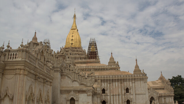 Wide exterior view of Ananda Temple with golden stupa and historic Buddhist architecture in Bagan, Myanmar.