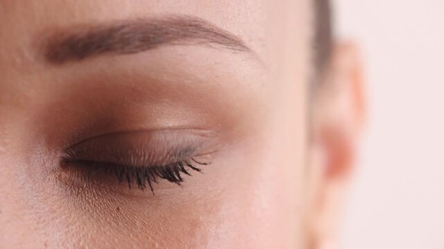 Eye, face and vision with woman in studio for optometry, eyesight health and glaucoma test. Closeup, ophthalmology and ocular care with person, optical assessment and portrait on white background