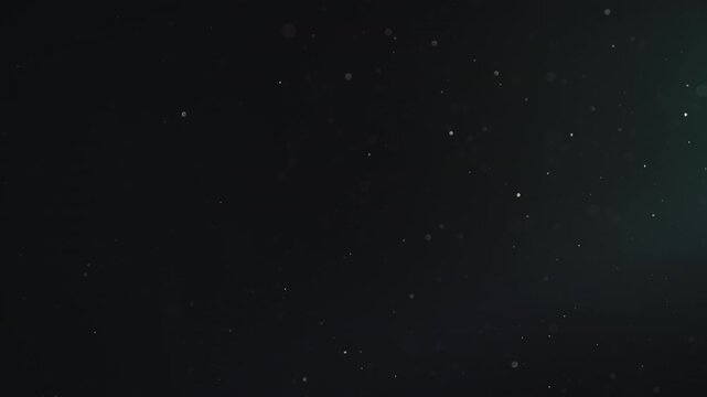 Slow motion real dust particles floating mid air over dark background