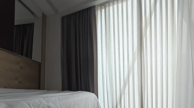 Automatic curtains in the bedroom, sunlight. Curtains bed ceiling. High quality 4k footage
