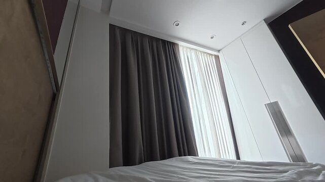 Automatic curtains in the bedroom, sunlight. Curtains bed ceiling. High quality 4k footage