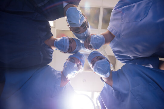 Modern Middle Eastern eye hospital surgical team preparing for operation in small Egyptian clinic