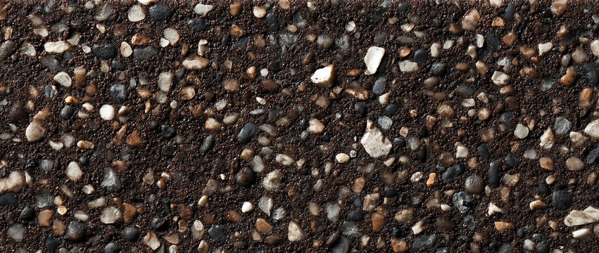 a dark brown background speckled with a high concentration of small, angular and rounded aggregate pieces