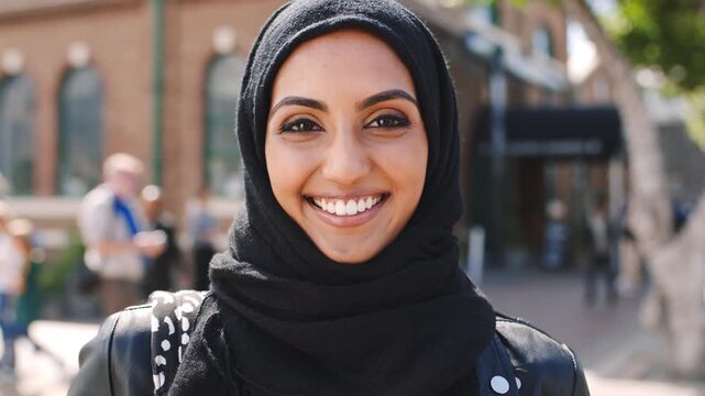 University, face or muslim woman in city with commute, optimism or pride in study opportunity. Happy, Arab person or college student with hijab, morning travel or confidence in academic course.