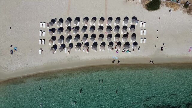 Overhead aerial view of beach lounge area, Mediterranean sea, Paros