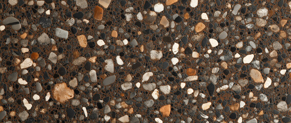 Fototapeta premium a dark brown background speckled with a high concentration of small, angular and rounded aggregate pieces