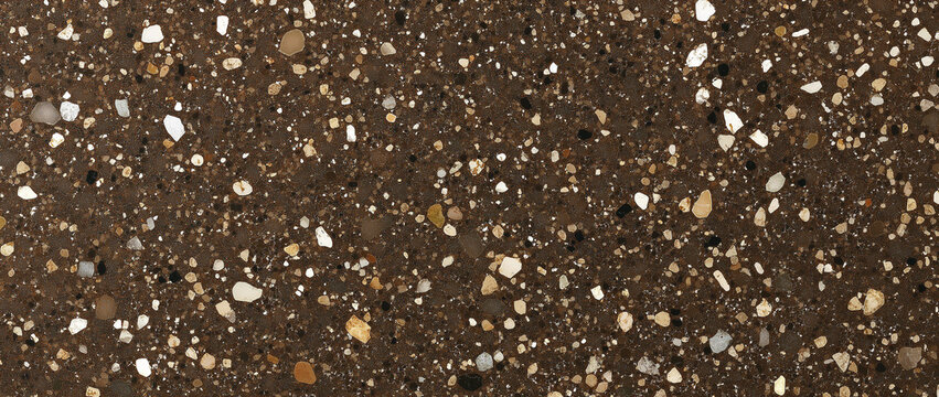 a dark brown background speckled with a high concentration of small, angular and rounded aggregate pieces