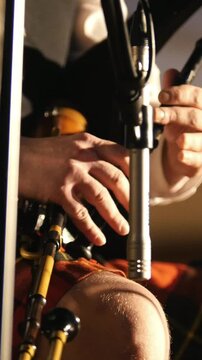 Bagpipe player in a kilt plays musical instrument at the stage