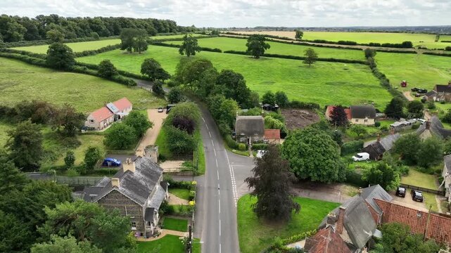 Aerial Drone View of Country Road Through Warkton Village Northamptonshire England