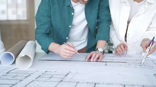 Architects and engineers collaborating on construction blueprint design, planning project details. Architecture and business concept