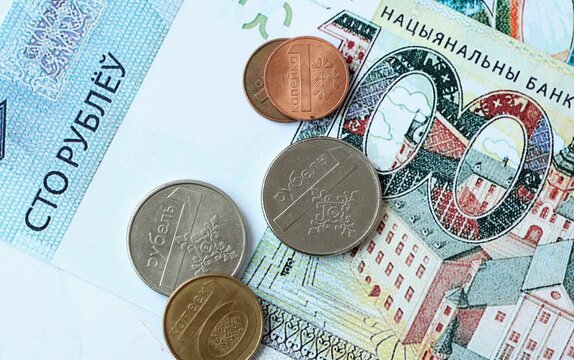 Belarusian ruble money bills and coins on table. Belarus cash of BYN currency close up
