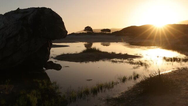 lagoon, Klein mountains, Grotto Beach, Hermanus, South Africa at sunset
