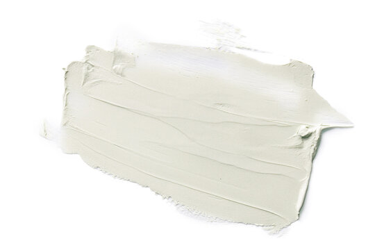 Large light green cosmetic cream smear on white background.