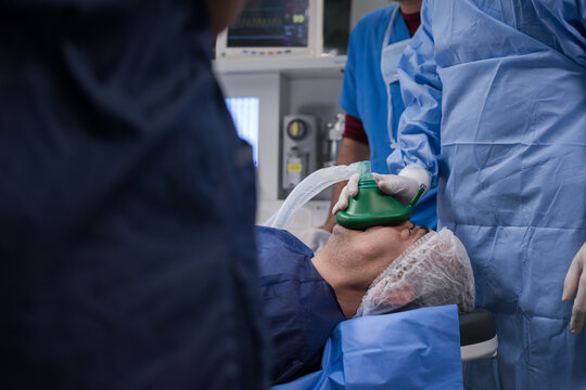 Surgical team administering anesthesia to patient before eye operation at a modern Egyptian eye hospital