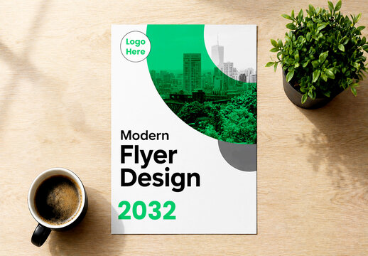 Modern Flyer Mockup on Wooden Desk with Coffee Cup and Plant in Bright Interior