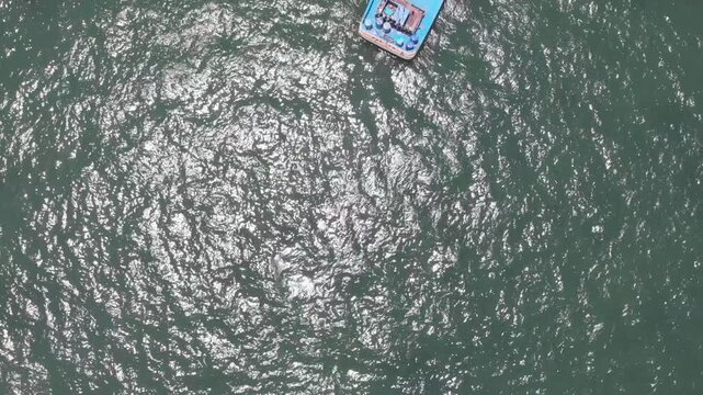 Aerial view of Paracas Bay with tourist boats and pier, Ica, Peru.