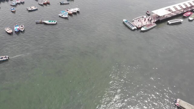 Aerial view of Paracas Bay with tourist boats and pier, Ica, Peru.