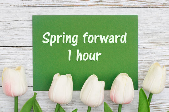Spring forward one hour card with tulips