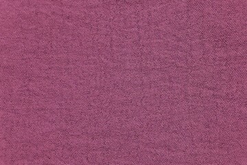 Fototapeta premium Magenta purple knitted fabric texture background macro close up