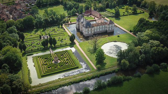 Aerial view of Chateau de Cormatin with its moat, geometric formal gardens, and a hedge maze Cormatin, Bourgogne-Franche-Comte, France.